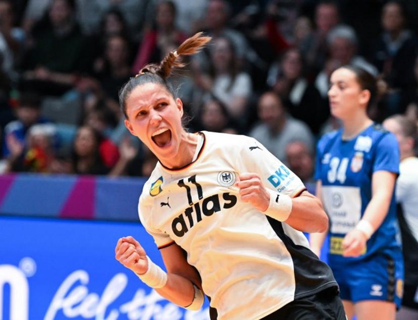 Germany's left back #11 Xenia Smits reacts after she scored during the preliminary round group C match between Germany and Serbia at the IHF Women's Handball World Championship  in Stuttgart, southern Germany, on November 30, 2025.  THOMAS KIENZLE / AFP