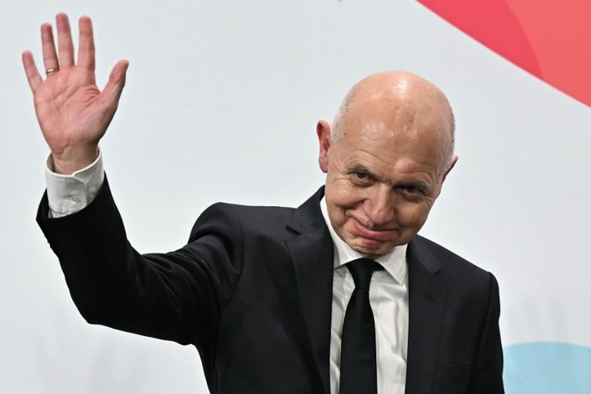 German Football Association (DFB) president Bernd Neuendorf waves to the audience after Germany was elected to host the UEFA Women's EURO 2029 fooball tournament during an announcement ceremony at the UEFA headquarters, the House of European Football, in Nyon on December 3, 2025. European football's governing body UEFA announced on December 3, 2025 that Germany will host the women's 2029 European Championships, where England will be the two-time defending champions.  Fabrice COFFRINI / AFP