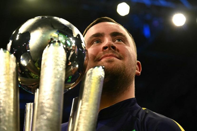 England's Luke Littler poses with the Sid Waddell Trophy after victory over Netherlands' Michael van Gerwen in the PDC World Darts Championship final, at Alexandra Palace in London on January 3, 2025. Luke Littler became darts' youngest world champion at just 17 after thrashing three-time winner Michael van Gerwen in front of an adoring home crowd at London's Alexandra Palace on Friday. This time there was no stopping "Luke the Nuke" as he stormed past Dutchman Van Gerwen by seven sets to three. Ben STANSALL / AFP