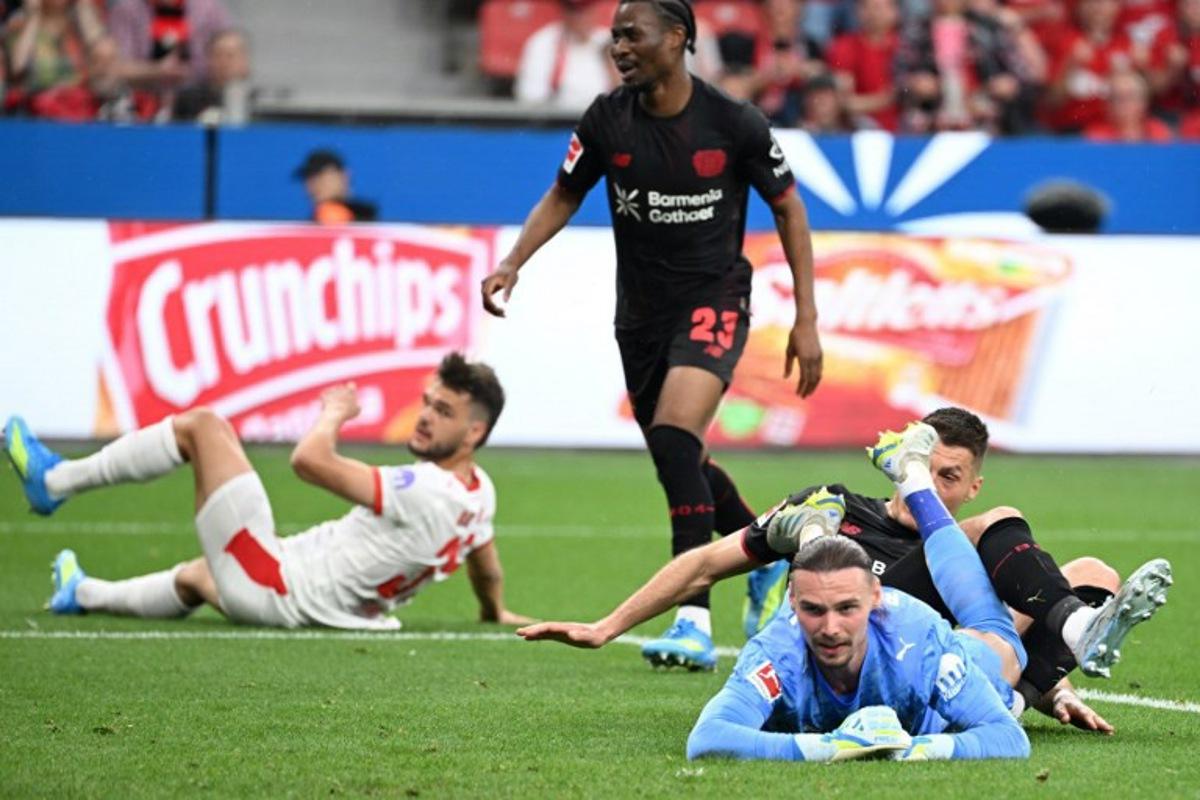 Bayer Leverkusen's Czech forward #14 Patrik Schick (R) reacts after scoring the 1-0 during the German first division Bundesliga football match between Bayer 04 Leverkusen and RB Leipzig in Leverkusen, western Germany, on May 2, 2026.   UWE KRAFT / AFP