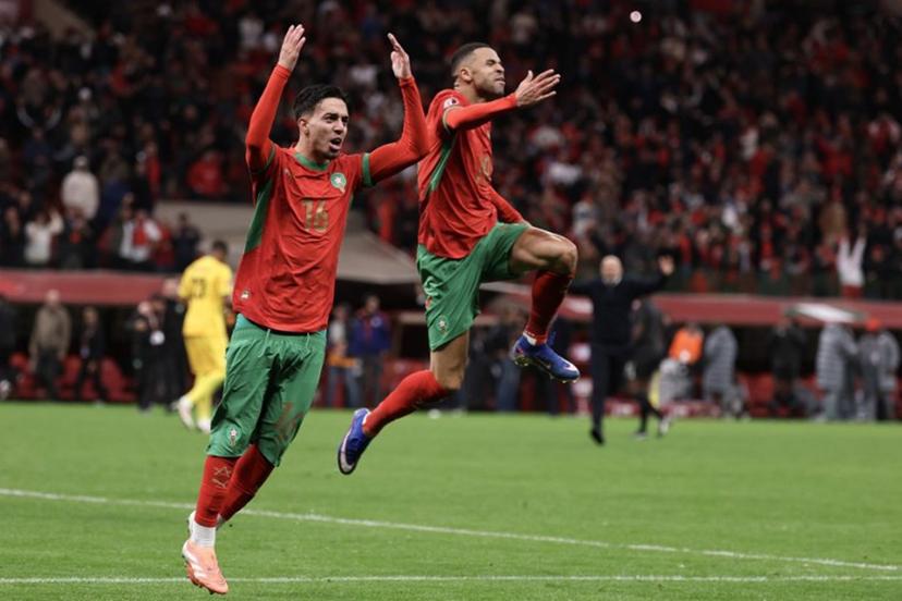 Morocco's forward #16 Ilias Akhomach and Morocco's forward #19 Youssef En-Nesyri celebrate winning the Africa Cup of Nations (CAN) semi-final football match between Nigeria and Morocco at the Prince Moulay Abdellah stadium in Rabat on January 14, 2026.   FRANCK FIFE / AFP