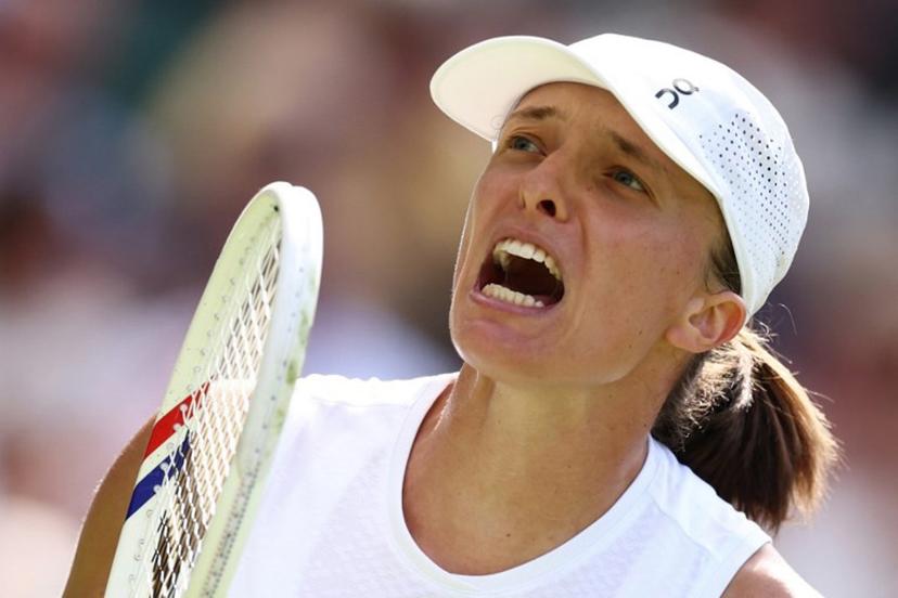 Poland's Iga Swiatek celebratres breating US player Taylor Townsend during their women's singles first round tennis match on the second day of the 2026 Wimbledon Championships at The All England Lawn Tennis and Croquet Club in Wimbledon, southwest London, on June 30, 2026.  Henry Nicholls / AFP