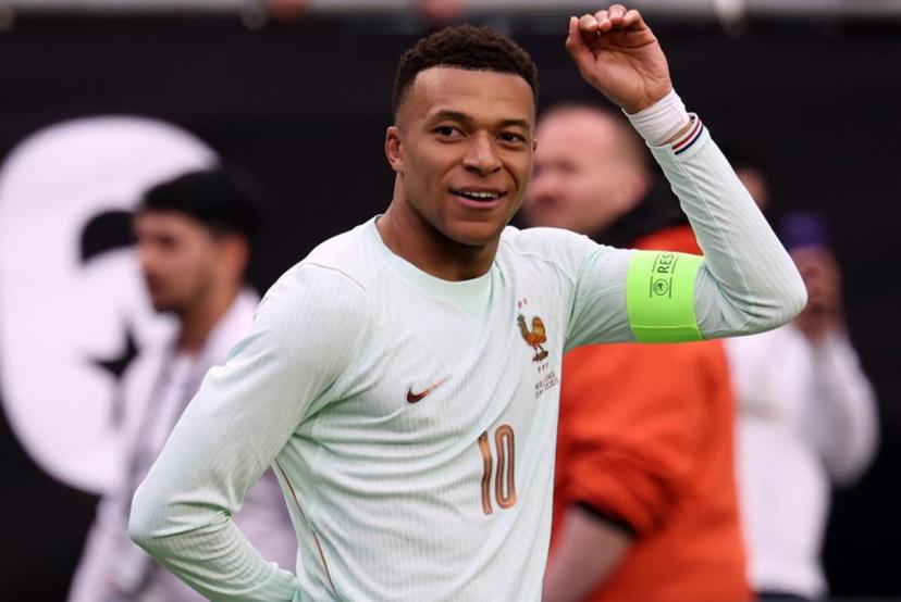 France's forward #10 Kylian Mbappe celebrates after scoring during a friendly football match between Brazil and France at Gillette Stadium in Foxborough, Massachusetts, on March 26, 2026.  FRANCK FIFE / AFP