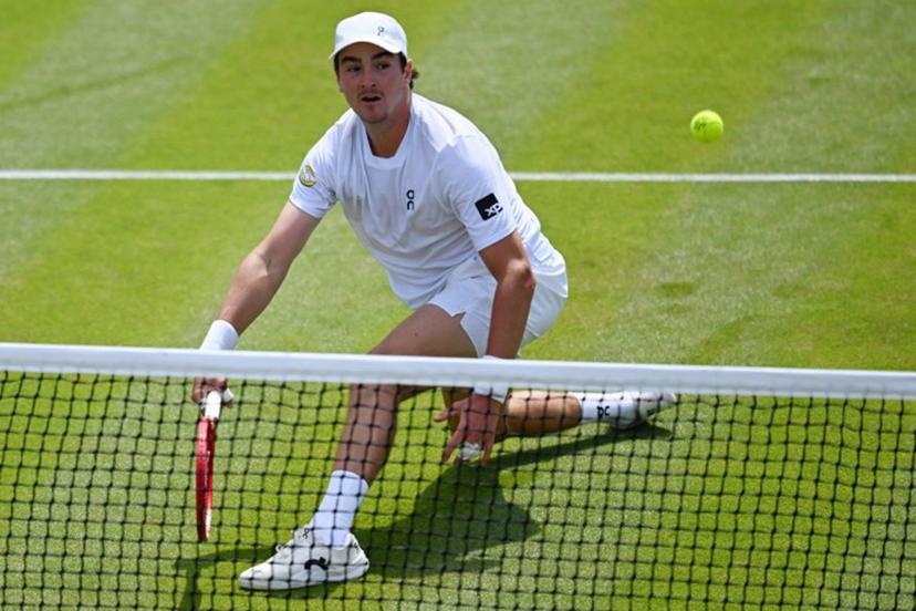 Brazil's Joao Fonseca returns to Russia's Roman Safiullin during their men's singles third round tennis match on the fifth day of the 2026 Wimbledon Championships at The All England Lawn Tennis and Croquet Club in Wimbledon, southwest London, on July 3, 2026.  Kirill KUDRYAVTSEV / AFP