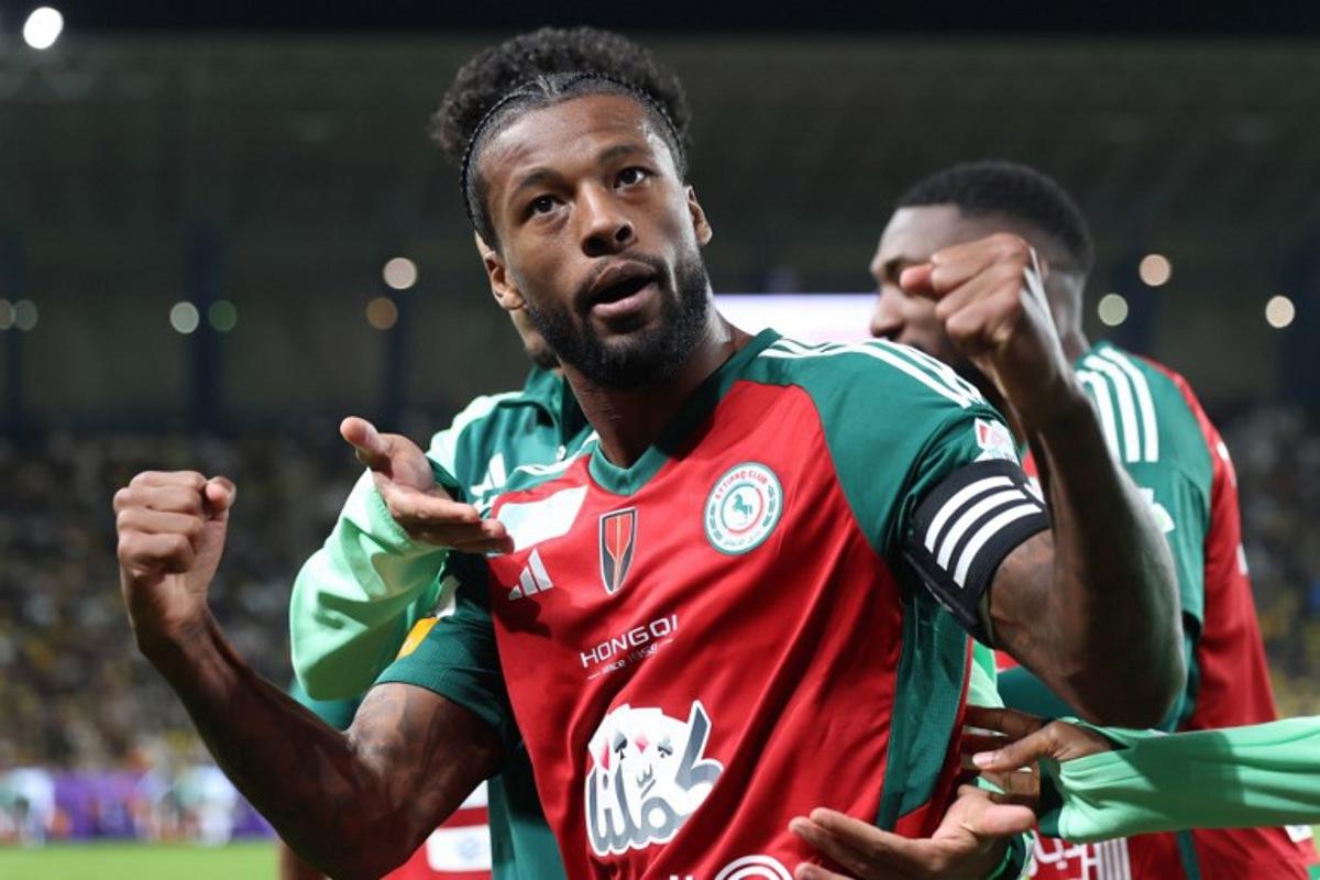 Ettifaq's Dutch midfielder #08 Georginio Wijnaldum celebrates scoring his team's third goal during the Saudi Pro League football match between Al-Nassr and Al-Ettifaq at Al-Awwal Park in Riyadh on February 21, 2025.  Fayez NURELDINE / AFP