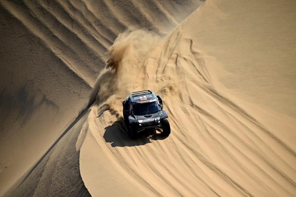 The Dacia Sandriders's Qatari driver Nasser Al-Attiyah and Belgian co-pilot Fabian Lurquin compete in Stage 10 of the 48th edition of the Dakar Rally 2026, between Bisha and Bisha, Saudi Arabia, on January 14, 2026.   Giuseppe CACACE / AFP