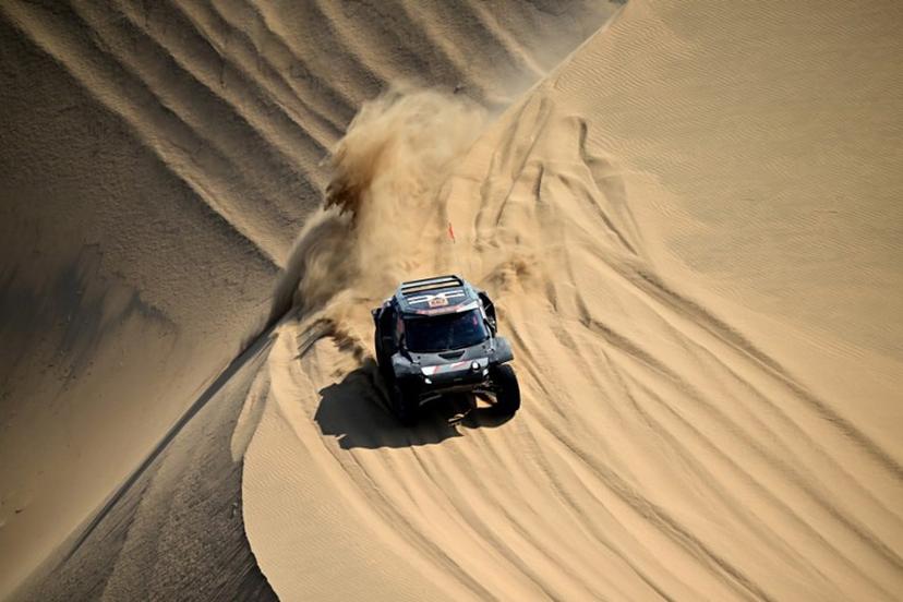 The Dacia Sandriders's Qatari driver Nasser Al-Attiyah and Belgian co-pilot Fabian Lurquin compete in Stage 10 of the 48th edition of the Dakar Rally 2026, between Bisha and Bisha, Saudi Arabia, on January 14, 2026.   Giuseppe CACACE / AFP