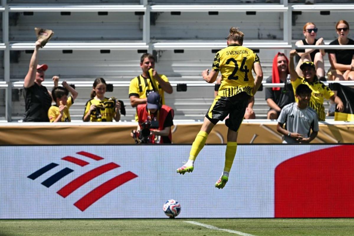 Borussia Dortmund's Swedish defender #24 Daniel Svensson celebrates scoring his team's first goal during the FIFA Club World Cup 2025 Group F football match between Germany's Borussia Dortmund and South Korea's Ulsan HD at the TQL stadium in Cincinnati on June 25, 2025.  Paul ELLIS / AFP