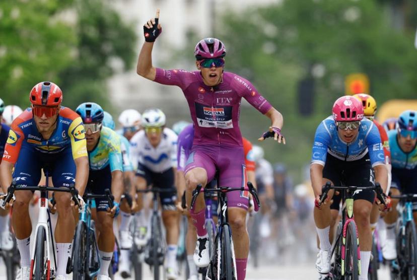 Soudal Quick-Step French rider Paul Magnier wearing the points classification mauve jersey (Maglia Ciclamino) celebrates as he crosses the finish line to win the 3nd stage of the Giro d'Italia 2026 - Tour of Italy cycling race between Plovdiv and Sofia, Bulgaria, on May 10, 2026.  Luca Bettini / AFP