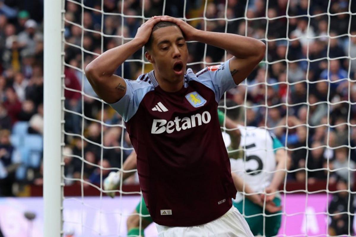 Aston Villa's Belgian midfielder #08 Youri Tielemans reacts after his shot hit the post during the English Premier League football match between Aston Villa and Newcastle United at Villa Park in Birmingham, central England on April 19, 2025.  Darren Staples / AFP