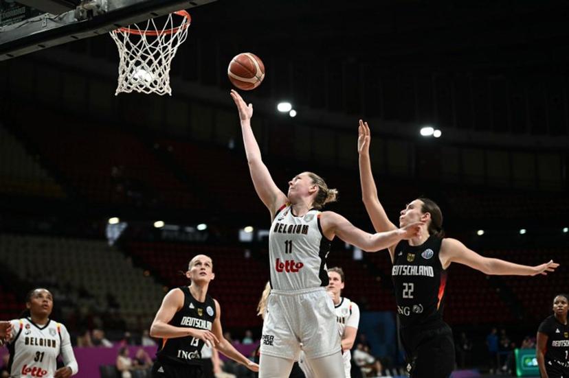 Belgium's power forward Emma Meesseman (C) attempts a lay-up as she is defended by Germany's small forward Emily Bessoir (R) during the FIBA Women's EuroBasket 2025 quarter-final match between Belgium and Germany at the Peace and Friendship Stadium in Piraeus near Athens on June 25, 2025.  Angelos Tzortzinis / AFP