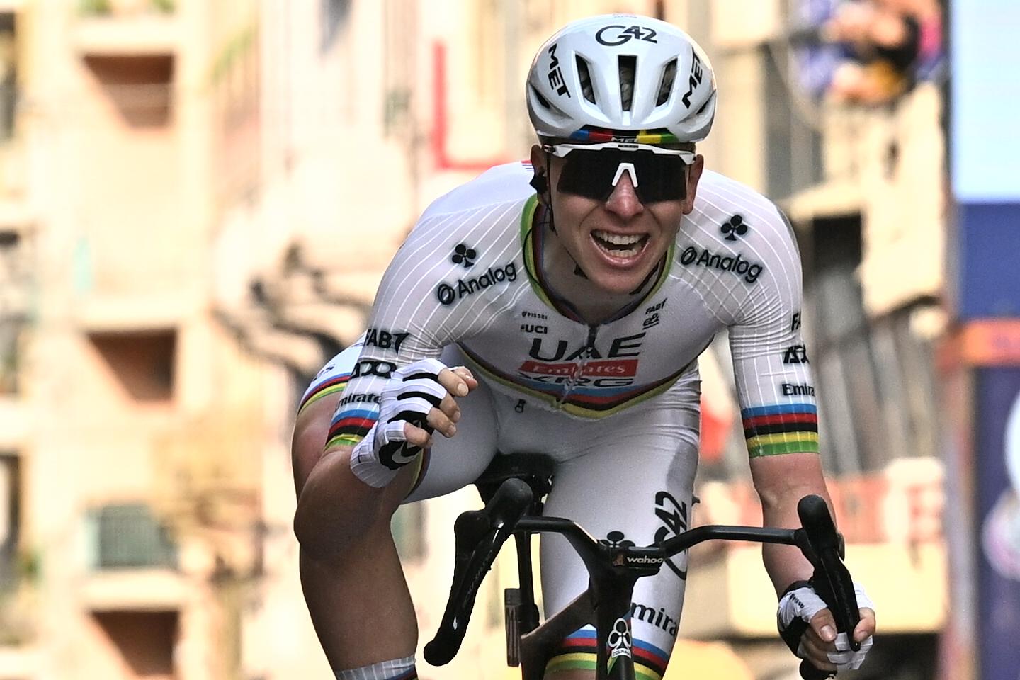 Slovenian Tadej Pogacar celebrates as he crosses the finish line to win the 'Milano-Sanremo' one day cycling race for men, 298km from Milan to San Remo, Italy, Saturday 21 March 2026. BELGA PHOTO DAVID PINTENS