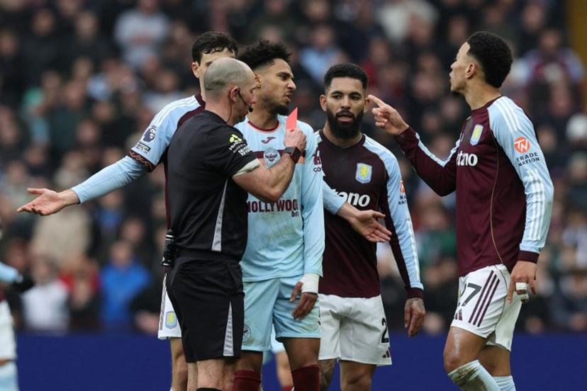 Brentford's German midfielder #07 Kevin Schade (C) is shown a red card by English referee Tim Robinson during the English Premier League football match between Aston Villa and Brentford at Villa Park in Birmingham, central England on February 1, 2026.  Darren Staples / AFP