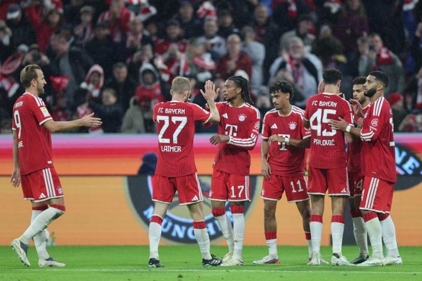 Bayern Munich's French midfielder #17 Michael Olise (3rd L) celebrates scoring the 3-0 goal with his teammates during the German first division Bundesliga football match between FC Bayern Munich and RB Leipzig in Munich, southern Germany, on October 17, 2026.  Alexandra BEIER / AFP