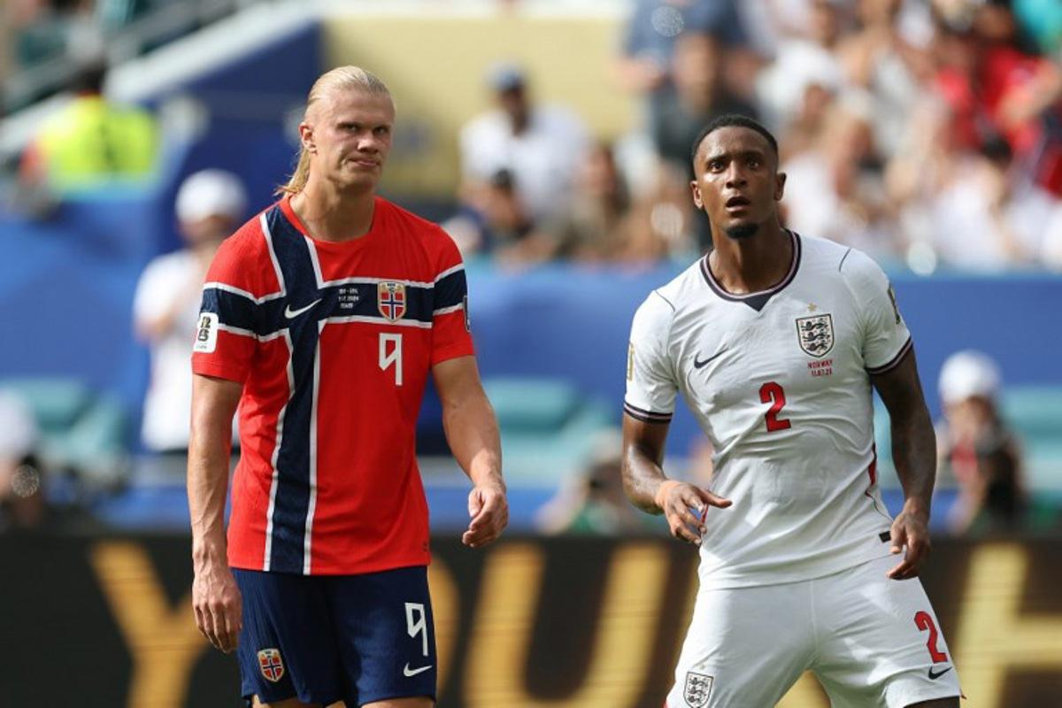 Norway's forward #09 Erling Braut Haaland reacts next to England's defender #02 Ezri Konsa during the 2026 World Cup football tournament quarter-final match between Norway and England at Miami Stadium in Miami Gardens on July 11, 2026.   PATRICIA DE MELO MOREIRA / AFP