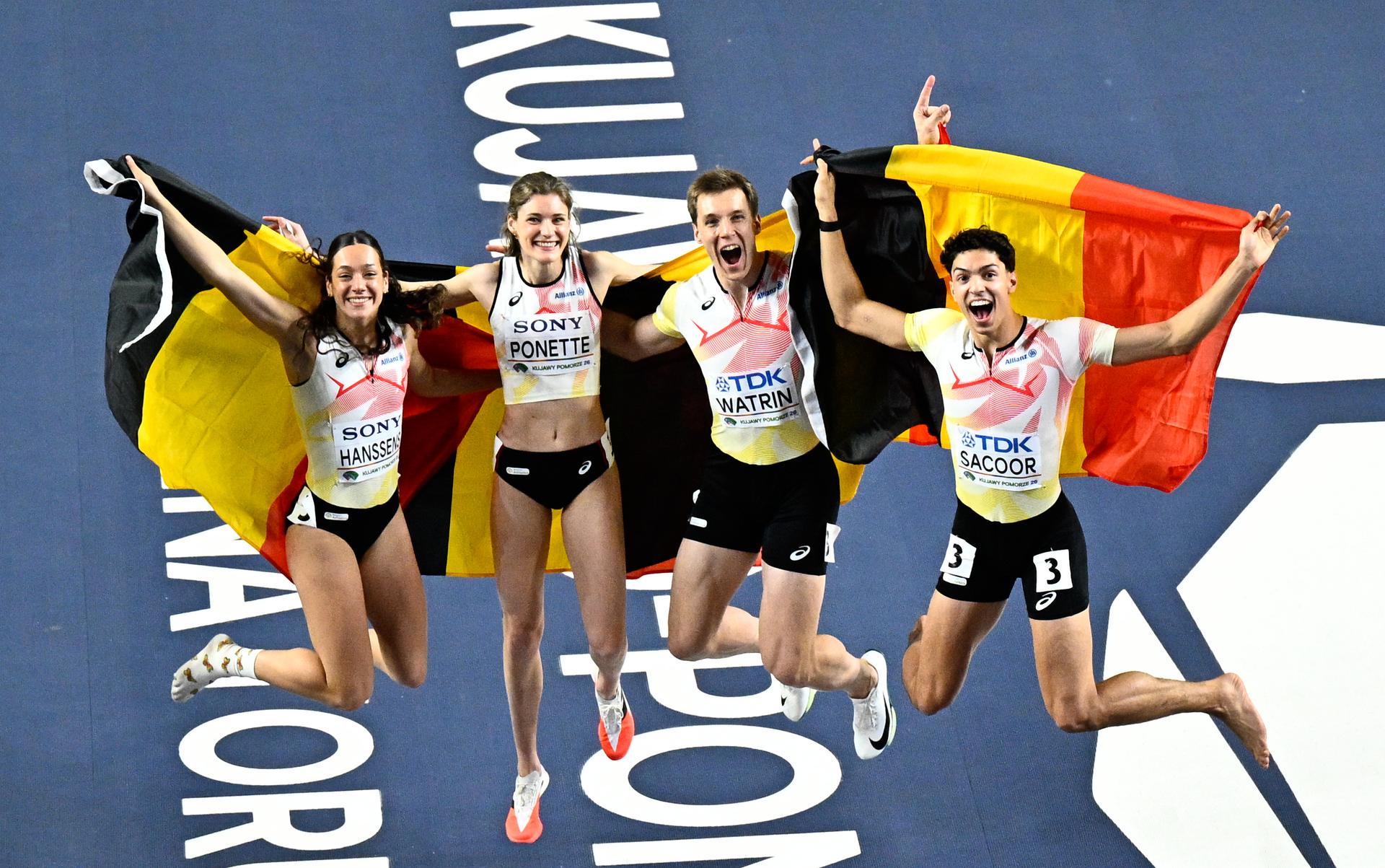 Belgian athlete Ilana Hanssens, Belgian Helena Ponette, Belgian Julien Watrin, Belgian Jonathan Sacoor, celebrate after winning the 4x400m mixed relay, at and  the second day of the World Athletics Indoor Championship in Torun, Poland on Saturday 21 March 2026. The championships take place from 20 to 22 March. BELGA PHOTO JASPER JACOBS