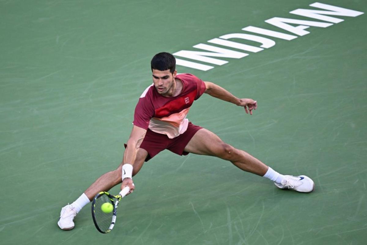 Spain's Carlos Alcaraz returns the ball to Britain's Jack Draper during the men's singles semi-final tennis match at the BNP Paribas Open at the Indian Wells Tennis Garden in Indian Wells, California, on March 15, 2025.  Patrick T. Fallon / AFP