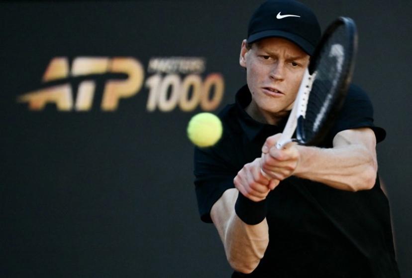 Italy's Jannik Sinner hits a return to Norway's Casper Ruud during the men's final of the ATP Rome Open tennis tournament at Foro Italico in Rome on May 17, 2026.   Filippo MONTEFORTE / AFP