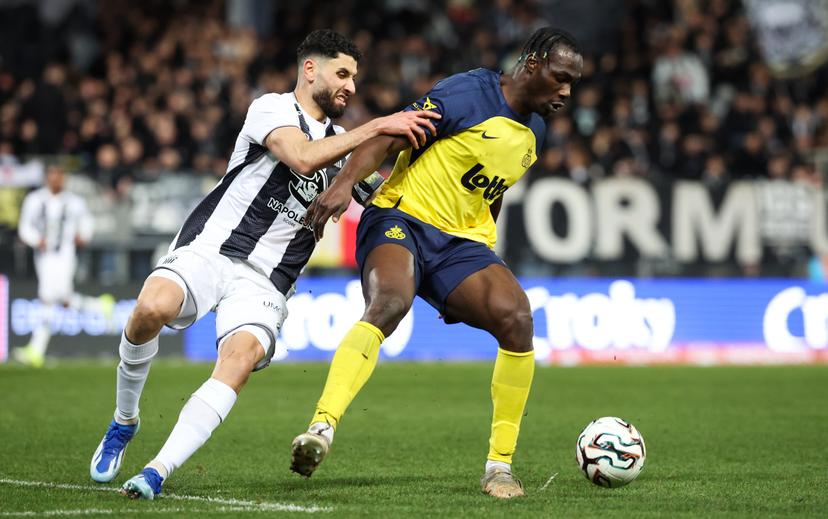Charleroi's Aiham Ousou and Union's Promise David fight for the ball during a soccer game between Sporting Charleroi and Royale Union Saint-Gilloise, a first leg 1/2 final game in the Croky Cup Belgian cup competition, Wednesday 04 February 2026 in Charleroi. BELGA PHOTO VIRGINIE LEFOUR