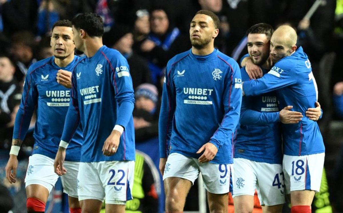 Rangers' Belgian midfielder #43 Nicolas Raskin (2R) celebrates scoring the opening goal during the UEFA Europa League football match between Rangers and Royale Union Saint-Gilloise at the Ibrox Stadium in Glasgow on January 30, 2025.  ANDY BUCHANAN / AFP