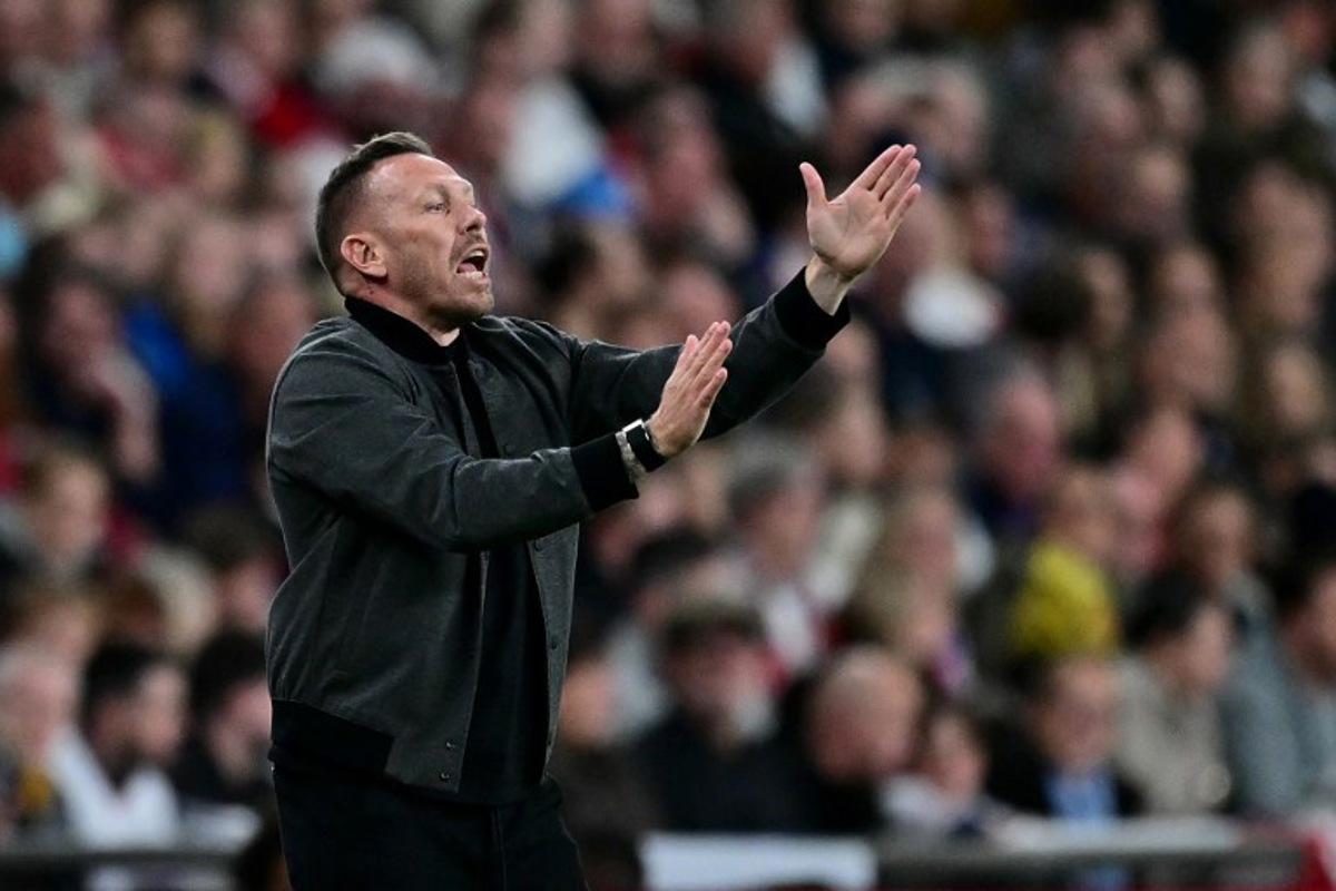 Wales' head coach Craig Bellamy shouts instructions to the players from the touchline during the friendly football match between England and Wales at Wembley Stadium in London on October 9, 2025.   Ben STANSALL / AFP