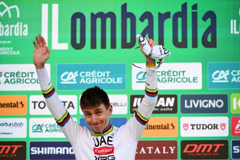 UAE Team Emirates's Slovenian rider Tadej Pogacar celebrates his victory on the podium after the 119th edition of the Giro di Lombardia (Tour of Lombardy), a 238km cycling race from Como to Bergamo on October 11, 2025.  Marco BERTORELLO / AFP