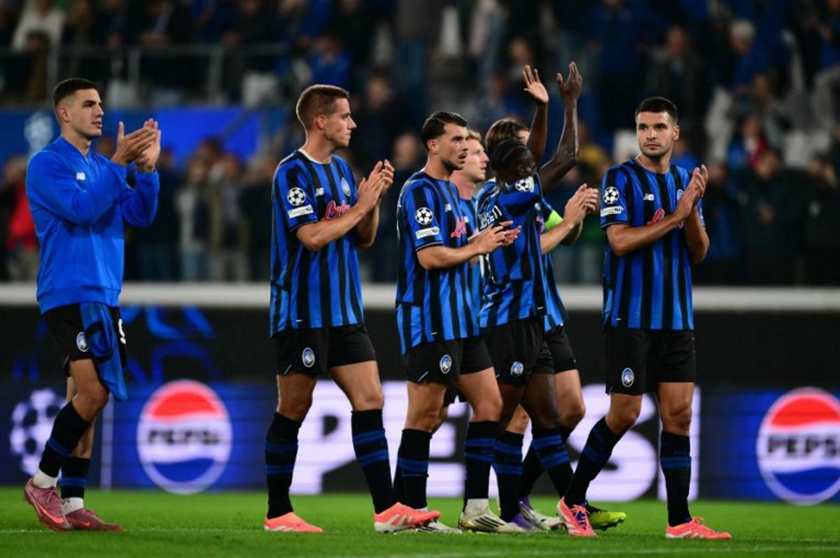 Players celebrate after winning the UEFA Champions League phase day 2 football match between Atalanta and Club Brugge at the Gewiss stadium in Bergamo, on September 30, 2025.   Marco BERTORELLO / AFP