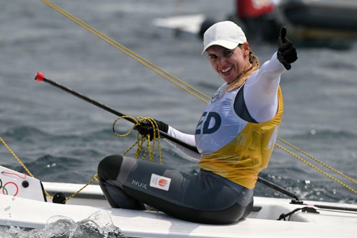 Gold medallist Netherlands' Marit Bouwmeester celebrates at the end of the women's ILCA 6 single-handed dinghy medal race during the Paris 2024 Olympic Games sailing competition at the Roucas-Blanc Marina in Marseille on August 7, 2024.   NICOLAS TUCAT / AFP