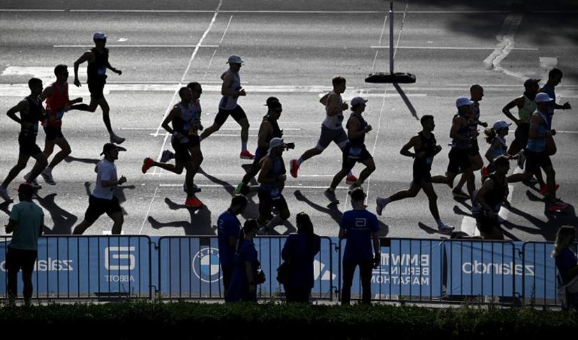 Runners take part in the 51st edition of the Berlin Marathon in Berlin, Germany on September 21, 2025.  Tobias SCHWARZ / AFP