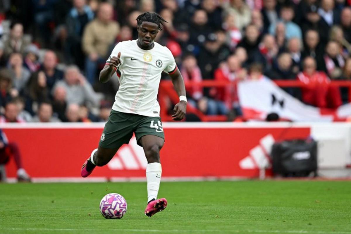 Chelsea's Belgian midfielder #45 Romeo Lavia passes the ball during the English Premier League football match between Nottingham Forest and Chelsea  at The City Ground in Nottingham, central England, on October 18, 2025.  JUSTIN TALLIS / AFP