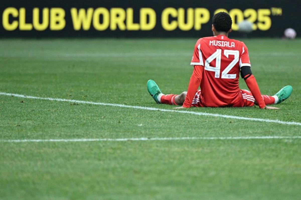 Bayern Munich's German midfielder #42 Jamal Musiala reacts during the FIFA Club World Cup 2025 quarterfinal football match between France's Paris Saint-Germain and Germany's Bayern Munich at the Mercedes-Benz Stadium in Atlanta on July 5, 2025.  PATRICIA DE MELO MOREIRA / AFP