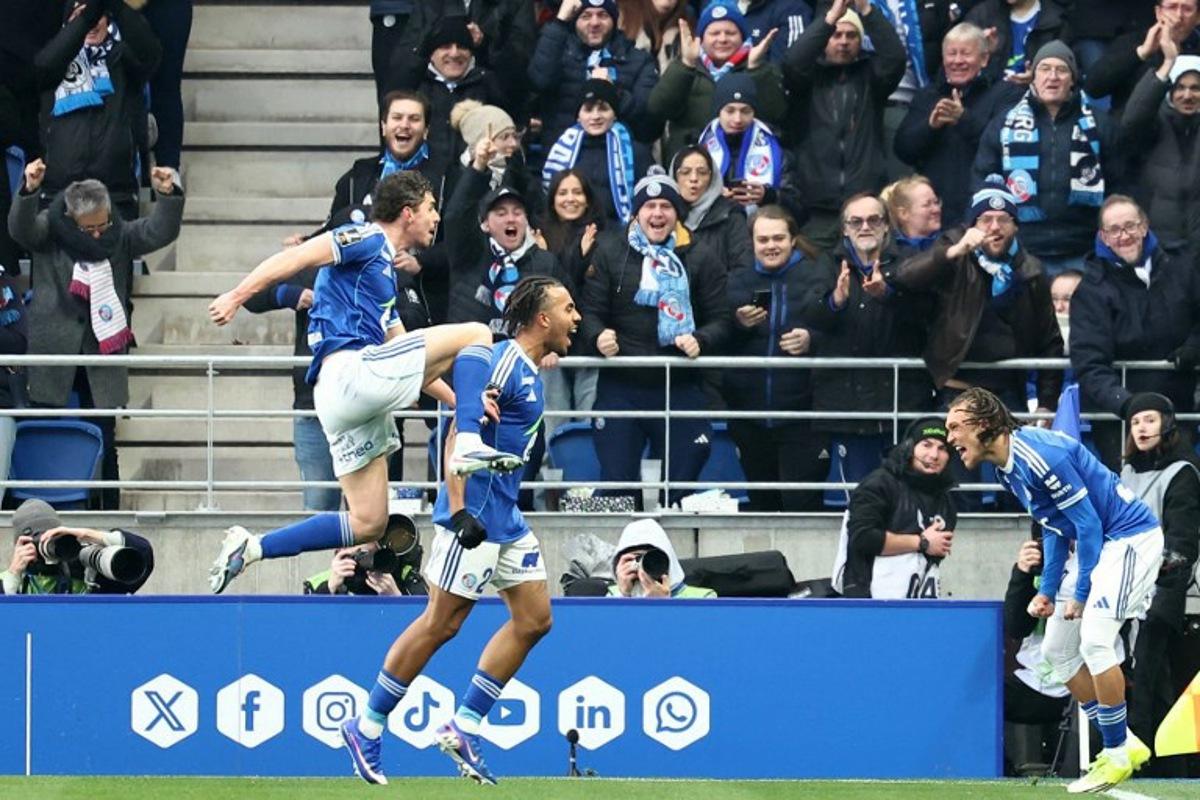 Strasbourg's Belgian midfielder #07 Diego Moreira (R) celebrates scoring his team's first goal during the French L1 football match between RC Strasbourg Alsace and FC Metz at the Stade de la Meinau in Strasbourg, eastern France, on January 18, 2026.   Frederick FLORIN / AFP