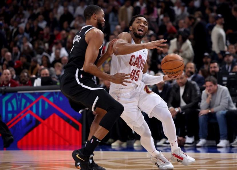 Cleveland Cavaliers' US Point Guard Donovan Mitchell (R) vies with Brooklyn Nets' US Point Guard Mikal Bridges (L) during the NBA regular season basketball match between the Cleveland Cavaliers and the Brooklyn Nets at the Accor Arena in Paris on January 11, 2024.  Emmanuel Dunand / AFP