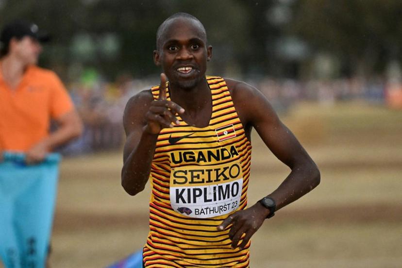 Uganda's Jacob Kiplimo celebrates after crossing the finish line to win the men's senior race during the 2023 World Cross Country Championships at Mount Panorama in Bathurst on February 18, 2023.   Saeed KHAN / AFP