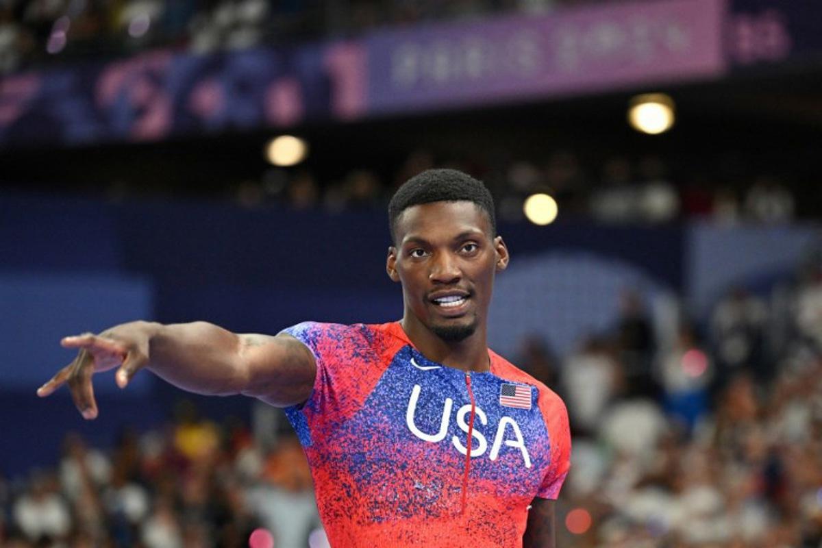 US' Fred Kerley celebrates after winning bronze in the men's 100m final of the athletics event at the Paris 2024 Olympic Games at Stade de France in Saint-Denis, north of Paris, on August 4, 2024.  Andrej ISAKOVIC / AFP