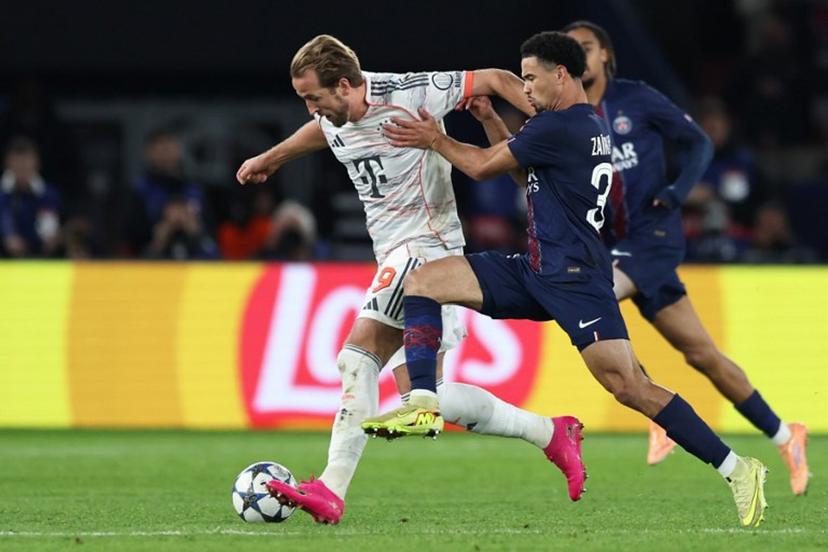 Bayern Munich's English forward #09 Harry Kane (L) fights for the ball with Paris Saint-Germain's French midfielder #33 Warren Zaire-Emery during the UEFA Champions League, league phase day 4, football match between Paris Saint-Germain (PSG) and FC Bayern Munich at the Parc des Princes in Paris, on November 4, 2025.  Thomas SAMSON / AFP
