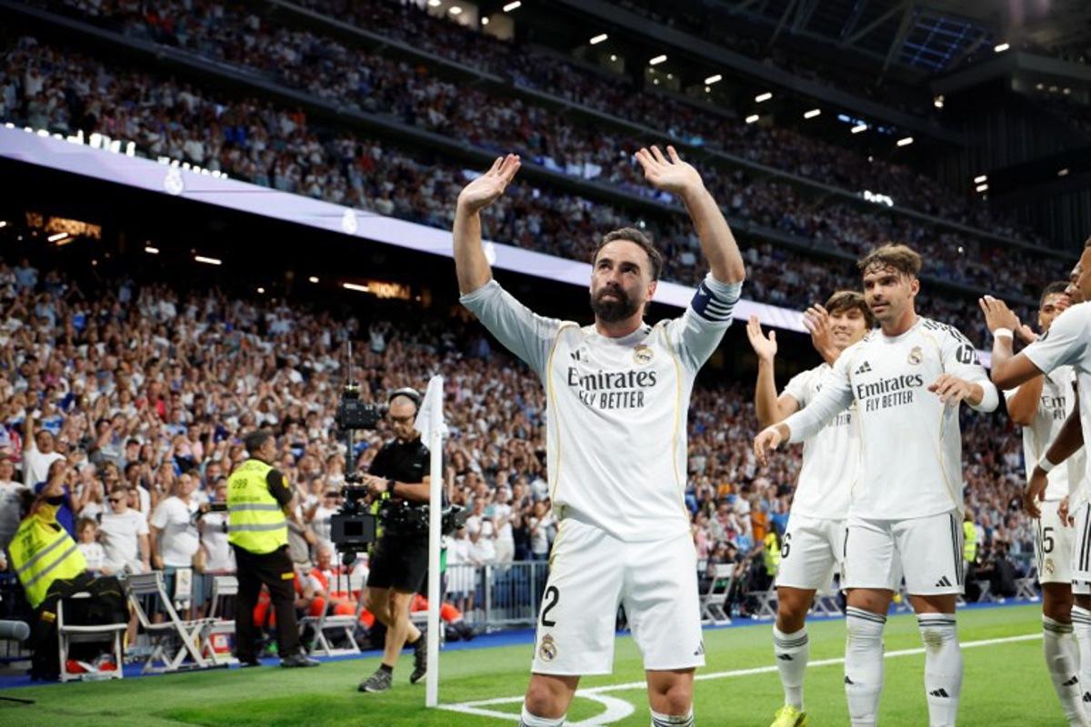 Real Madrid's Spanish defender #02 Dani Carvajal celebrates Real Madrid's Spanish forward #16 Gonzalo Garcia's goal during the Spanish league football match between Real Madrid CF and Athletic Club Bilbao at Santiago Bernabeu Stadium in Madrid on May 23, 2026.  Pierre-Philippe MARCOU / AFP