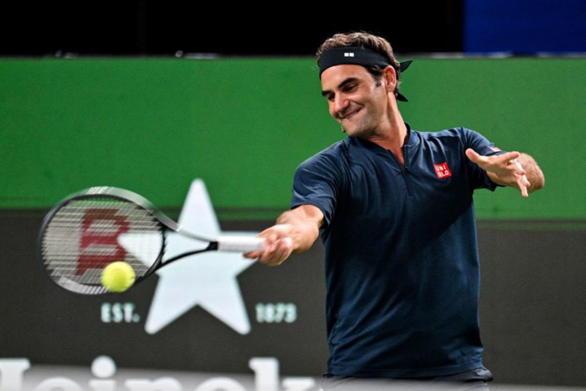 Swiss Roger Federer participates in the exhibition event Roger and friends celebrity doubles match at the Shanghai Masters tennis tournament in Shanghai on October 10, 2025.  Hector RETAMAL / AFP