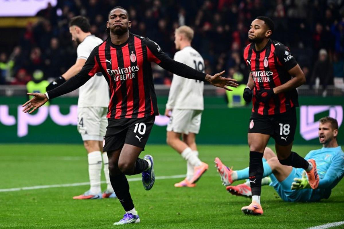 AC Milan's Portuguese forward #10 Rafael Leao (C) celebrates scoring his team's first goal during the Italian Serie A football match between AC Milan and Lazio at the San Siro stadium in Milan on November 29, 2025.  Piero CRUCIATTI / AFP