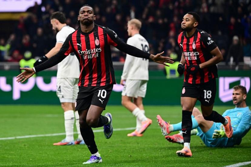 AC Milan's Portuguese forward #10 Rafael Leao (C) celebrates scoring his team's first goal during the Italian Serie A football match between AC Milan and Lazio at the San Siro stadium in Milan on November 29, 2025.  Piero CRUCIATTI / AFP