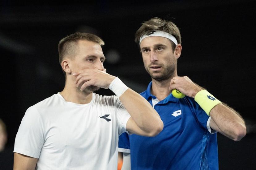 Poland's Jan Zielinski (L) and Belgium's Sander Gille speak during their men's doubles final tennis match against France's Benjamin Bonzi and France's Pierre-Hughes Herbert at the Marseille Open 13 ATP World Tour in Marseille, southern France on February 16, 2025.  MIGUEL MEDINA / AFP