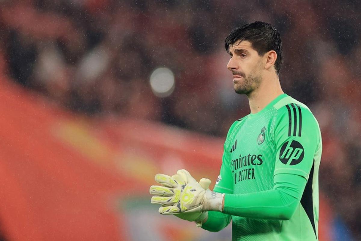Real Madrid's Belgian goalkeeper #01 Thibaut Courtois gestures at the end of the UEFA Champions League league phase day 8 football match between SL Benfica and Real Madrid CF at Estadio da Luz in Lisbon on January 28, 2026.  PATRICIA DE MELO MOREIRA / AFP