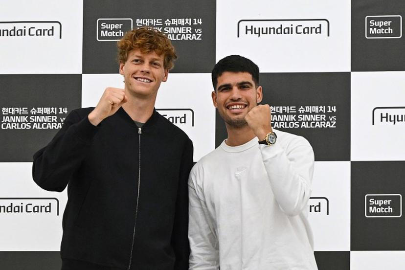 Italy's Jannik Sinner (L) and Spain's Carlos Alcaraz pose for a photo during a press conference at Hyundai Card headquarters in Seoul on January 9, 2026, ahead of their tennis exhibition match.  Jung Yeon-je / AFP