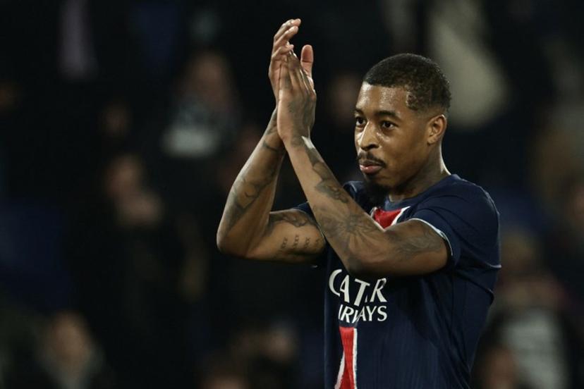 Paris Saint-Germain's French defender #03 Presnel Kimpembe celebrates PSG's victory at the end of the UEFA Champions League knockout phase play-off 2nd leg football match between Paris Saint-Germain (FRA) and Brest (FRA) at the Parc des Princes stadium in Paris on February 19, 2025.  Thibaud MORITZ / AFP