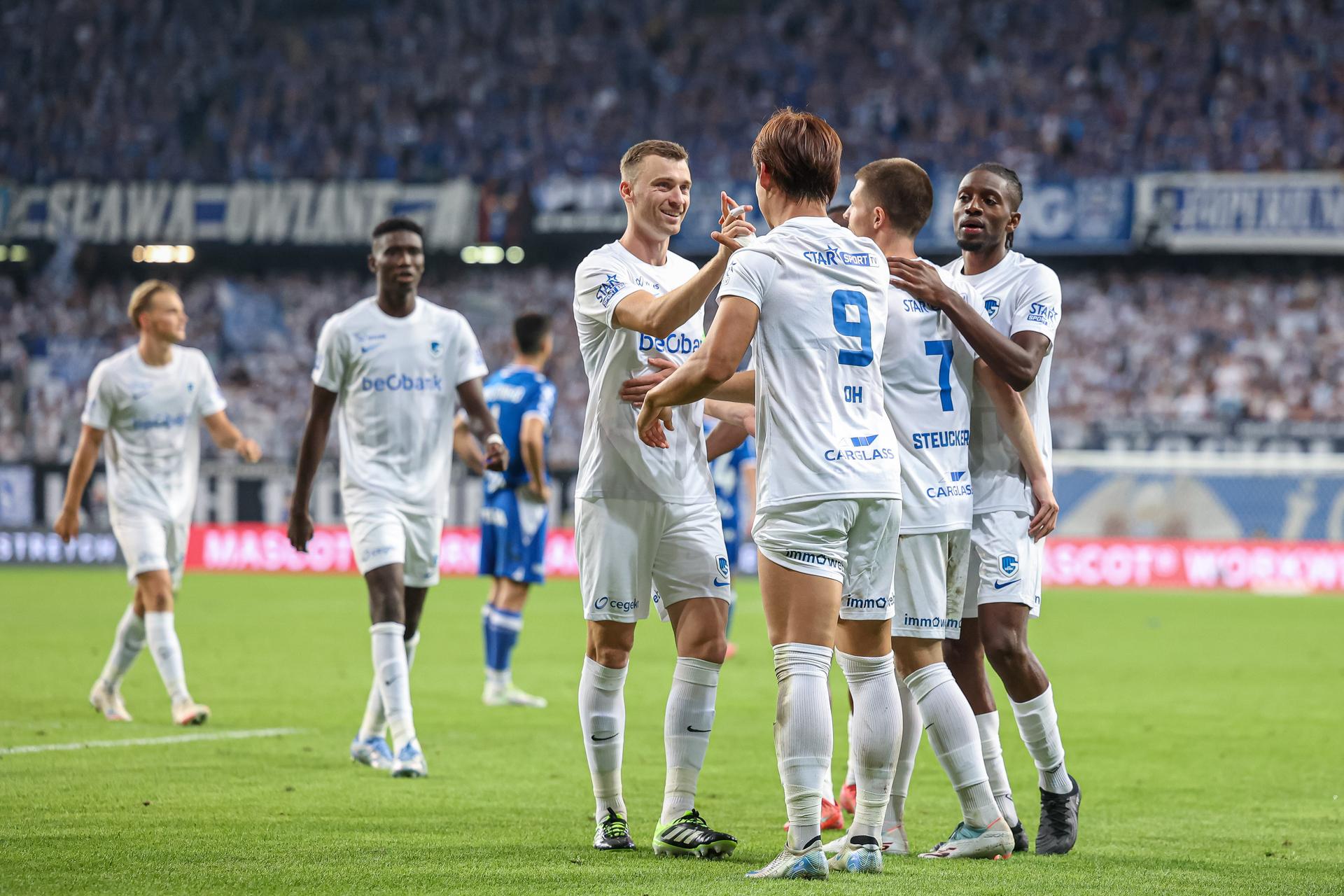 Genk's players celebrate after winning a game between Poland's Lech Poznan and Belgian soccer team KRC Genk, on Thursday 21 August 2025 in Poznan, Poland. The game is a first leg of the play-off round for the UEFA Europa League competition. BELGA PHOTO PAWEL JASKOLKA / PRESSFOCUS/NEWSPIX - POLAND OUT -