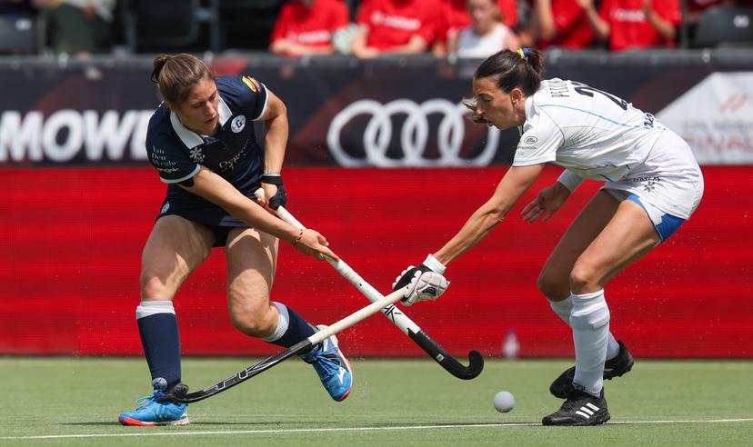 Gantoise's Astrid Bonami and Braxgata's Ivanna Pessina fight for the ball during a hockey game between Gantoise and Braxgata, Sunday 12 May 2024 in Antwerp, the return leg of the finals of the playoffs in the Belgian Hockey League women during the 2023-2024 season. BELGA PHOTO VIRGINIE LEFOUR
