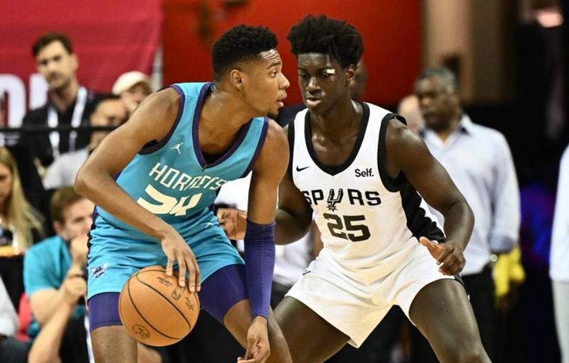 Charlotte Hornets' Brandon Miller (L) and San Antonio Spurs' Sidy Cissoko (R) vie for the ball during the NBA Summer League game between the San Antonio Spurs and Charlotte Hornets, at the Thomas and Mack Center in Las Vegas, Nevada, on July 7, 2023.  Patrick T. Fallon / AFP