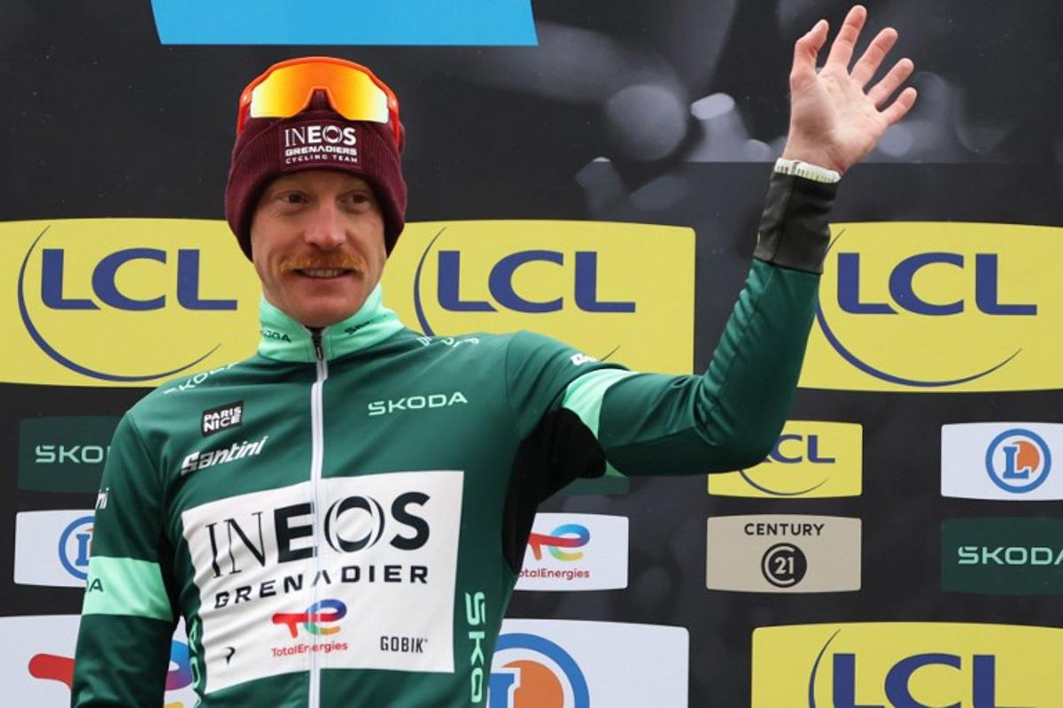 INEOS Grenadiers' French rider Dorian Godon celebrates his green jersey of best sprinter on the podium after the 7th stage of the Paris-Nice cycling race, 47 km between Le Broc and Isola-Village, on March 14, 2026. Due to deteriorating weather conditions, the route of stage 7 has been changed to a 47 km race from Le Broc to Isola. Anne-Christine POUJOULAT / AFP