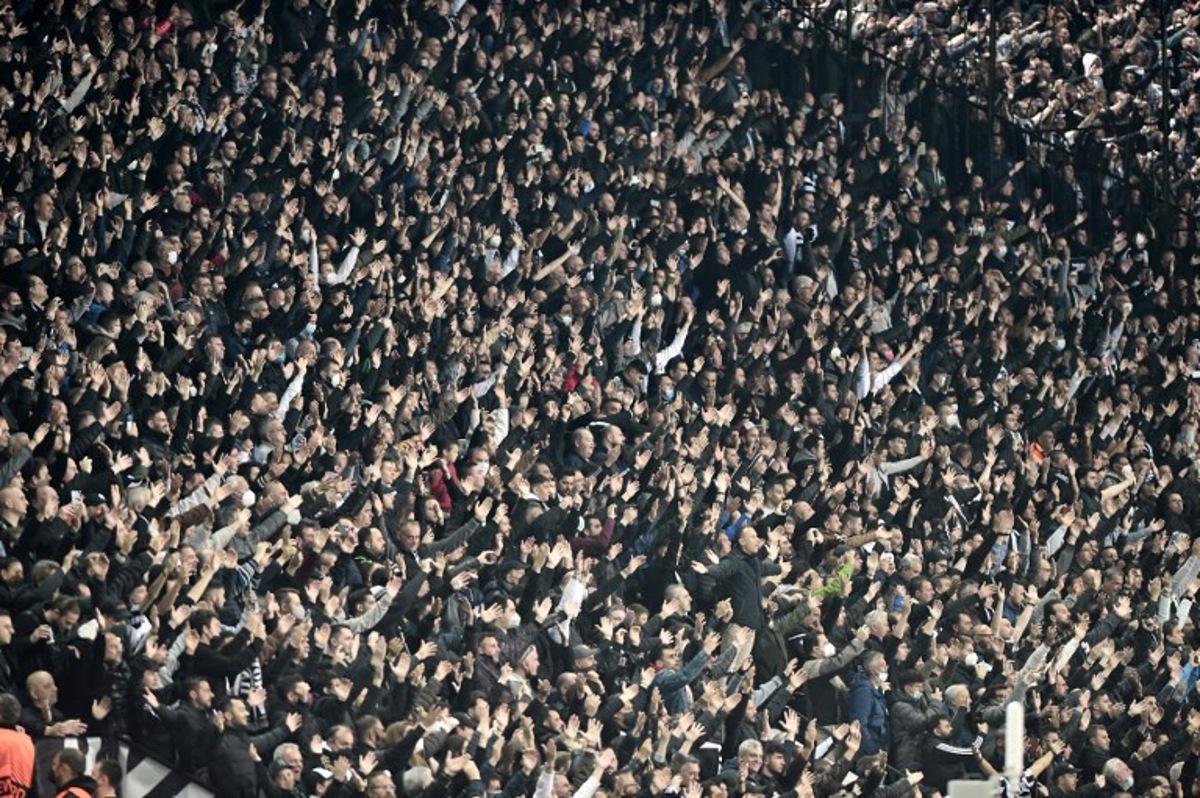 Paok's fans chant during the UEFA Europa Conference League quarter-final second leg football match between PAOK Thessaloniki and Olympique de Marseille (OM) at the Toumpa stadium in Thessaloniki on April 14, 2022.  Sakis MITROLIDIS / AFP