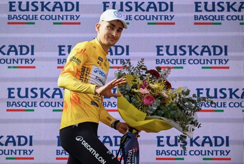 Team Decathlon CMA CGM's French rider Paul Seixas, the overall race leader and winner of the fifth stage of the Basque Country's Itzulia cycling tour, a 176.2 km race starting and finishing in Eibar, celebrates on the podium on April 10, 2026.   ANDER GILLENEA / AFP